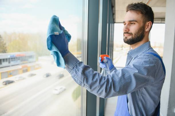 istock worker cleaning windows service on high rise building 1499647095