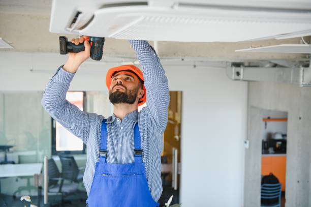 istock technician service checking and repairing air conditioner indoors 1499647214
