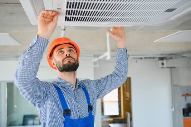 istock technician service checking and repairing air conditioner indoors 1499647239