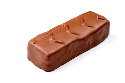 Chocolate bar on a white background. A chocolate bar with a filling is isolated on a white background.