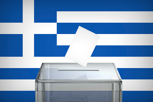Inserting vote into the ballot box, concept image for election in Greece