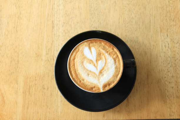 istock a cup of late coffee with flower shape design on top at cafe 1499650188
