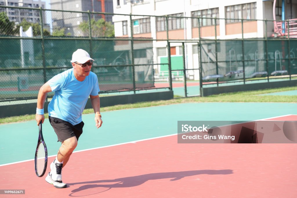 Asian Tennis Players Compete On Tennis Court Stock Photo Download