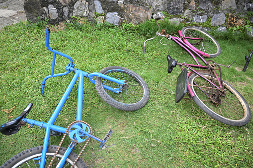 Child's bicycle lying flat on grass