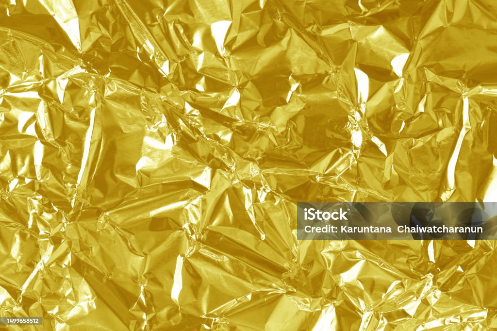 Shiny Gold Foil Texture Background Pattern Of Yellow Wrapping Paper With  Crumpled And Wavy Stock Photo - Download Image Now - iStock