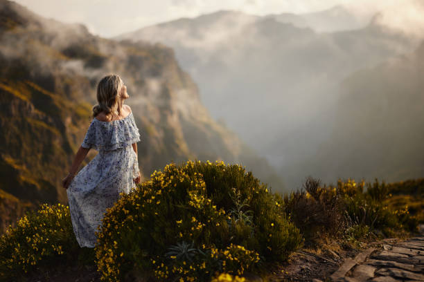 istock Carefree woman having fun on a mountain. 1499659351