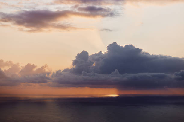 View of the sunset and cloudscape over Atlantic Ocean at Madeira island.