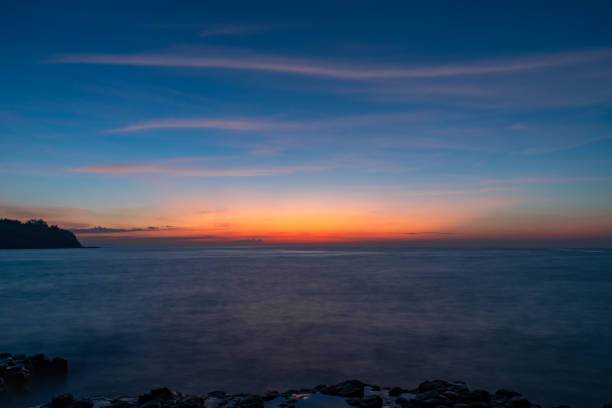 istock Colorful dawn dusk seascape exposure with clear blue sky with few clouds 1499659665