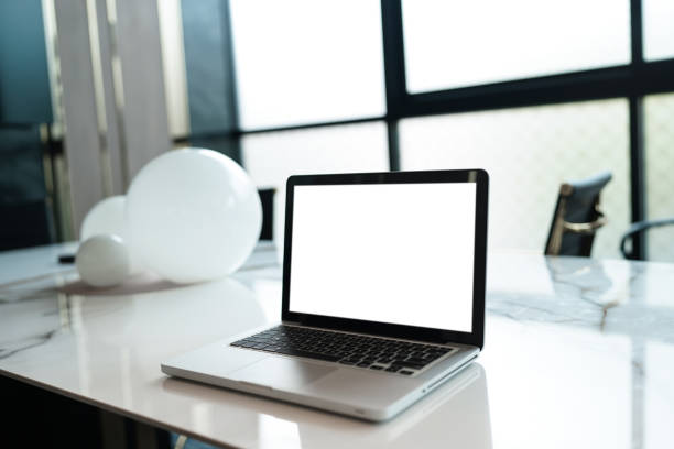 istock Laptop with Mock up blank screen on table in front of cafe space for text. product display computer laptop montage- technology concept 1499661498