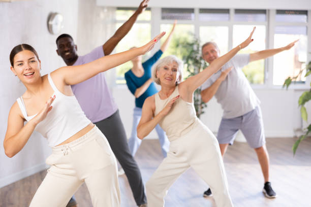 istock Men and women of different ages practicing Hip-hop dance in training hall 1499661643