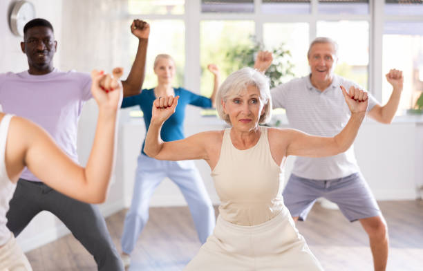 istock Senior woman learning to dance krump in modern choreographic studio 1499661646