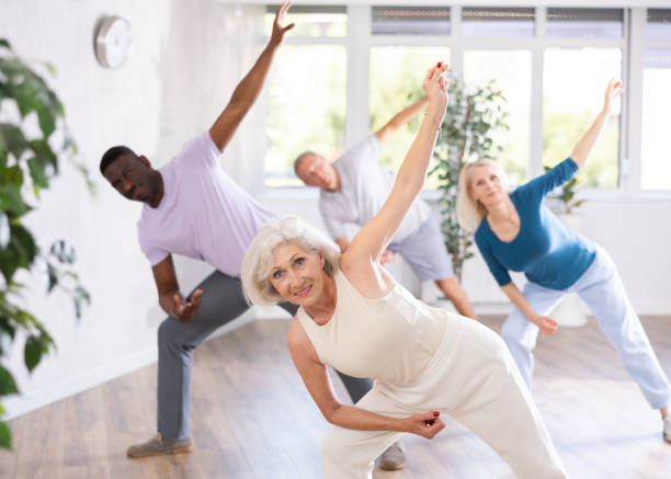 istock Elderly woman dancing hip hop during group dance class 1499661679