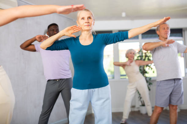 istock Elderly woman dancing hip hop during group dance class 1499662066