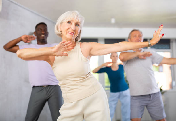 istock Mature men and women practicing Hip-hop dance in training hall 1499662070