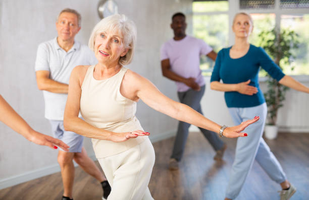 istock Senior woman dancing hip hop in studio practicing dance number. 1499662085