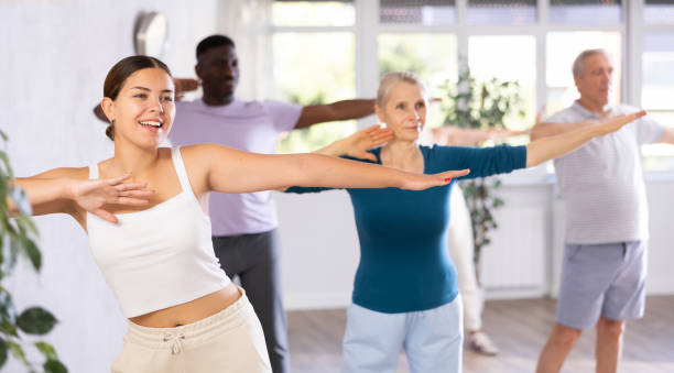 istock Young girl practicing hip-hop during group dance class 1499662547