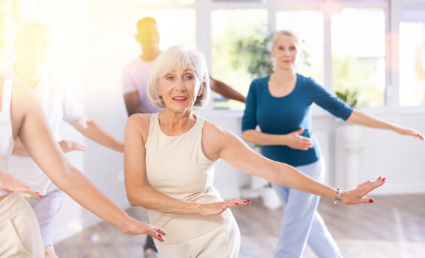 istock Mature men and women practicing Hip-hop dance in training hall 1499662694