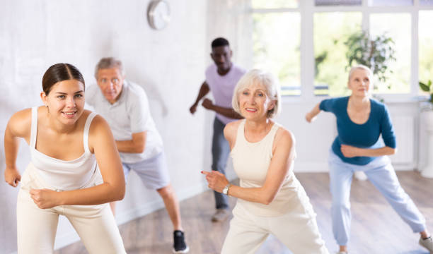 istock Men and women of different ages practicing Hip-hop dance in training hall 1499662707