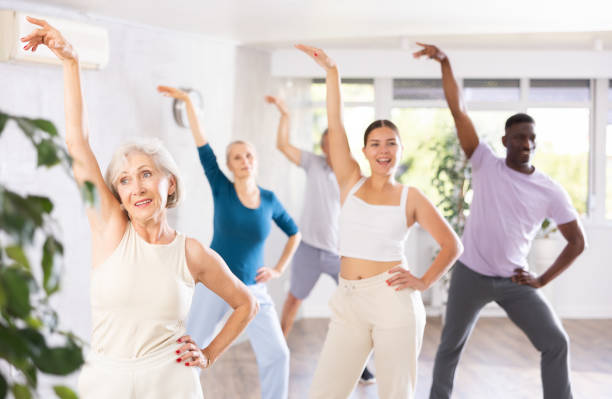 istock Elderly woman enjoying active dance with mixed age group 1499662719