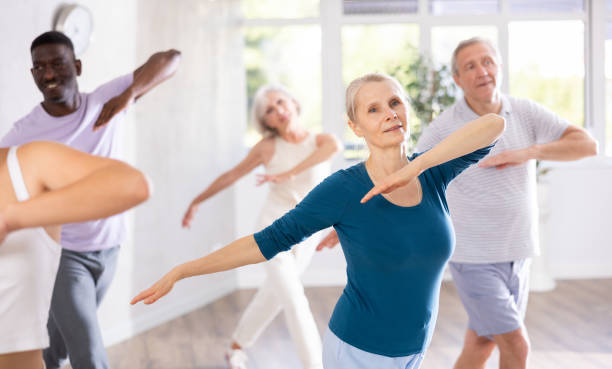 istock Senior woman dancing hip hop in studio practicing dance number. 1499662728