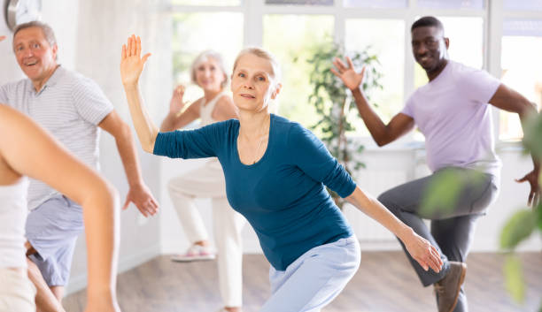 istock Senior woman dancing hip hop in studio practicing dance number. 1499662737