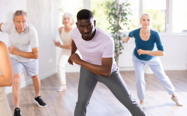 istock African American man dancing hip hop in studio practicing dance number. 1499662754