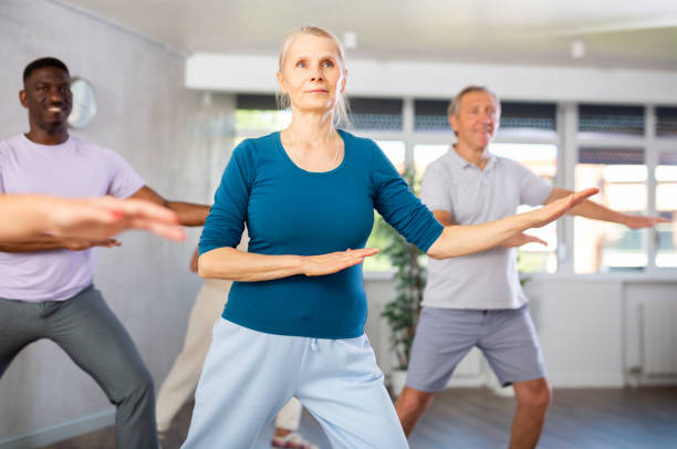 istock Mature men and women practicing Hip-hop dance in training hall 1499662841