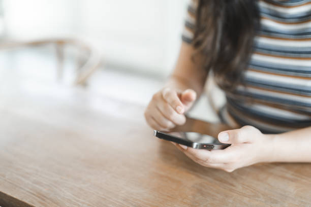 istock Women's Hands holding cell telephone working mobile devices. smart phone technology e-commerce concept 1499663454