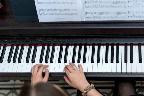 istock Piano Magic: Young and Elegant Pianist's Enthralling Musical Performance 1499668302