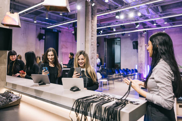 Businesswomen registering for a Tech conference. stock photo