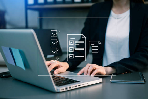 istock Checklist and filling survey form online. Document management system, DMS. Assessment form, questionnaire, checklist .Quality control and accuracy Check completeness.using a laptop and tablet 1499669665