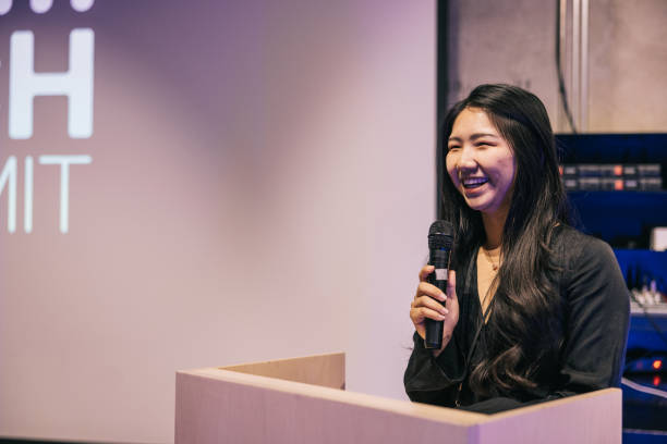 istock Chinese businesswoman speaking with audience on Tech conference. 1499669937