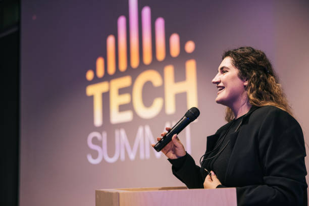 istock Confident businesswoman speaking with audience on Tech conference. 1499669945