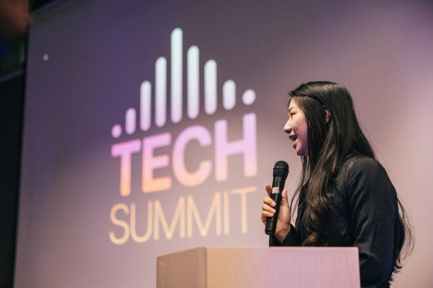 istock Chinese businesswoman speaking with audience on Tech conference. 1499669955