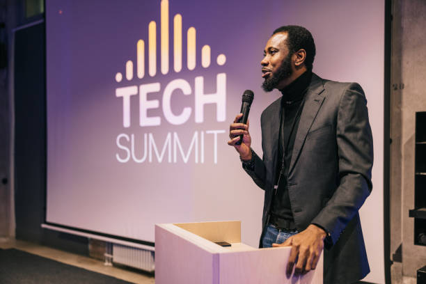 istock African Businessman speaking with audience on Tech conference. 1499669962