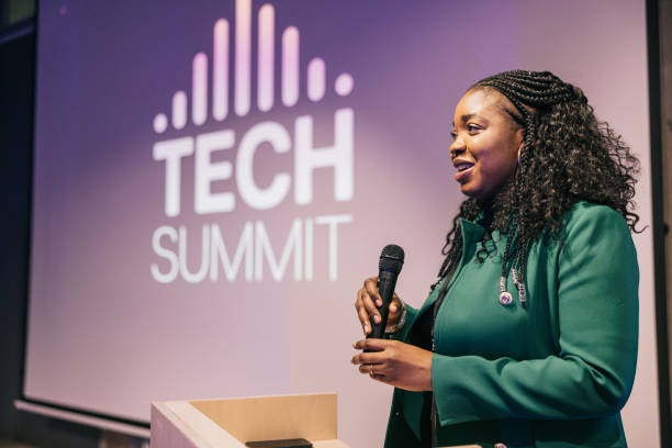 istock African Businesswoman speaking with audience on Tech conference. 1499669965