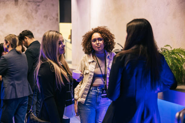 istock Multi ethnic Businesswoman mingle after successful Tech conference. 1499670000