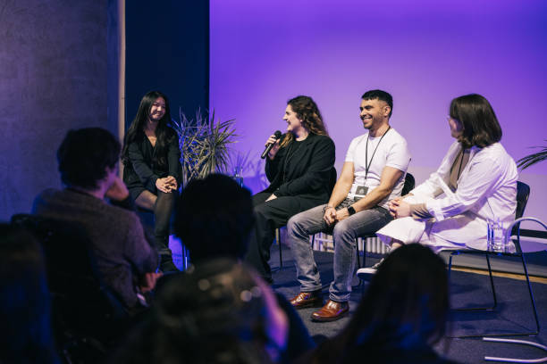 A group of multi ethnic entrepreneurs, making a great panel discussion on stage.