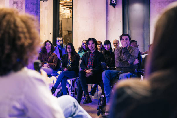 istock Diverse audience listening to panel discussion at business tech conference. 1499670319