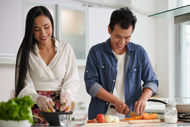 istock Couple Cooking Dinner Together 1499675527