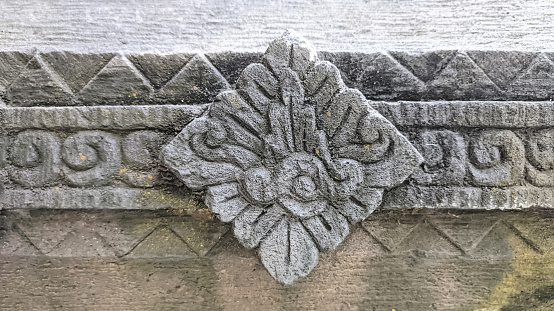 Stone relief with floral motifs at a tourist spot in Yogyakarta, Indonesia