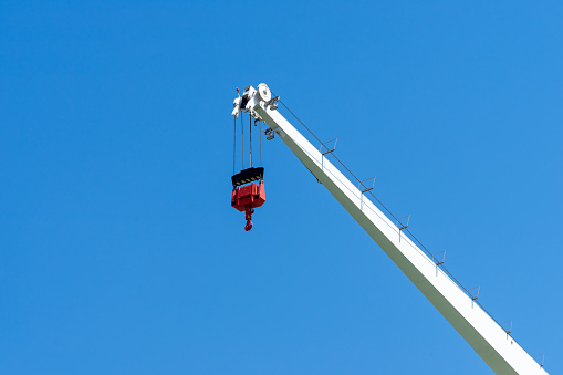 Low angle view of crane against clear blue sky, Hamburg harbor
