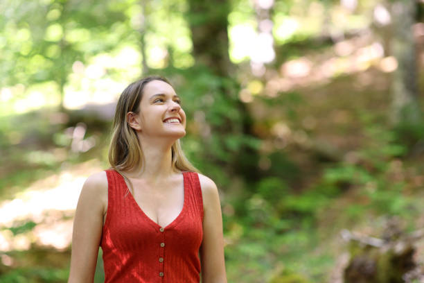 istock Woman contemplating views walking in a forest 1499681231