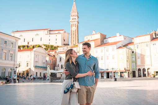 Beautiful romantic couple having fun in Venice city - Tourists traveling in Italy together in famous sightseeing - Holidays and happy lifestyle concept