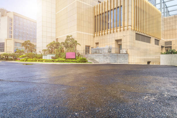 istock Modern urban architecture and unmanned asphalt pavement after rain, suitable for automobile advertising background. 1499681895