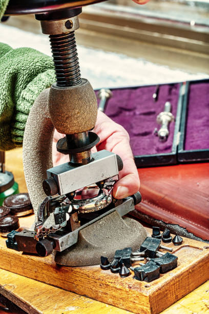 istock Artisan works on watch components in steampunk ambiance 1499683923