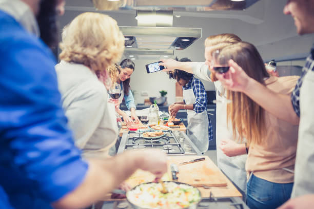 istock A Group of People Enjoying a Culinary Adventure, taking selfie 1499684292