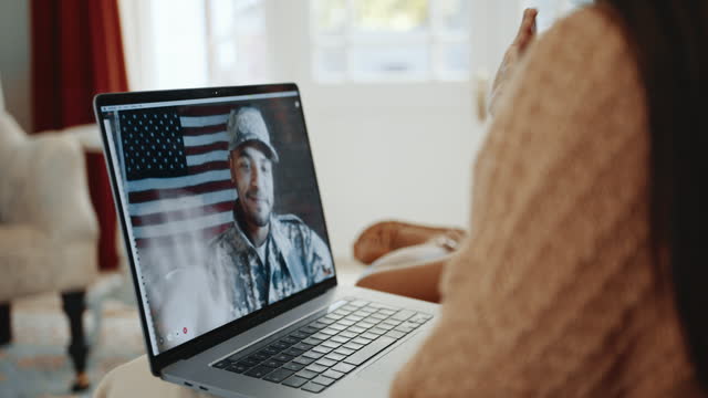 Deployed dad calls home from the military, he waves to his wife and kids on a video chat