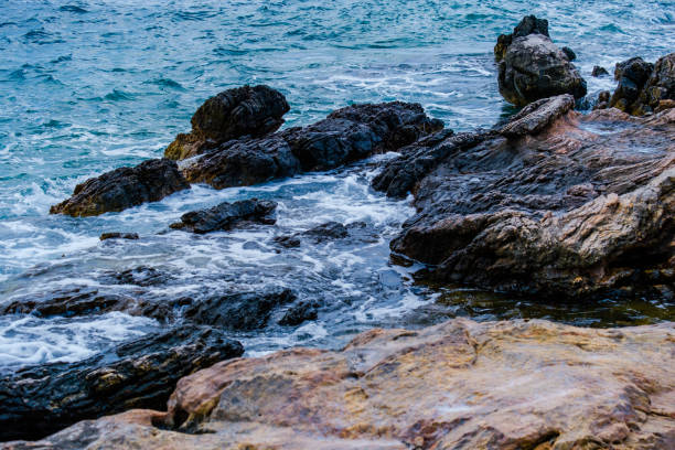 Rocky coast offshore with blue sea, rock formations,Greece