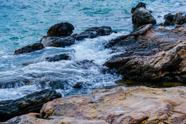 Rocky coast offshore with blue sea, rock formations,Greece